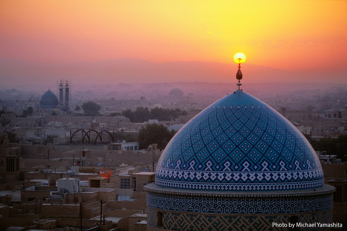 Sunset illuminates the 12th century Jame (Friday) Mosque, known for its striking blue Persian tile work.  Yzad, Iran